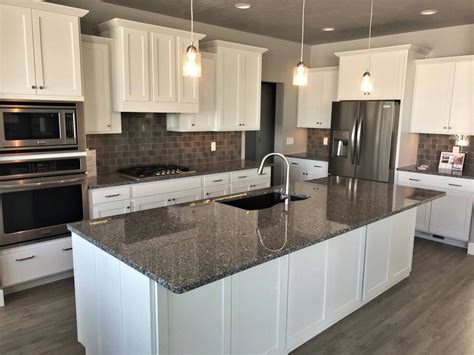 steel grey granite with dark cabinets|white cabinets with dark countertops.